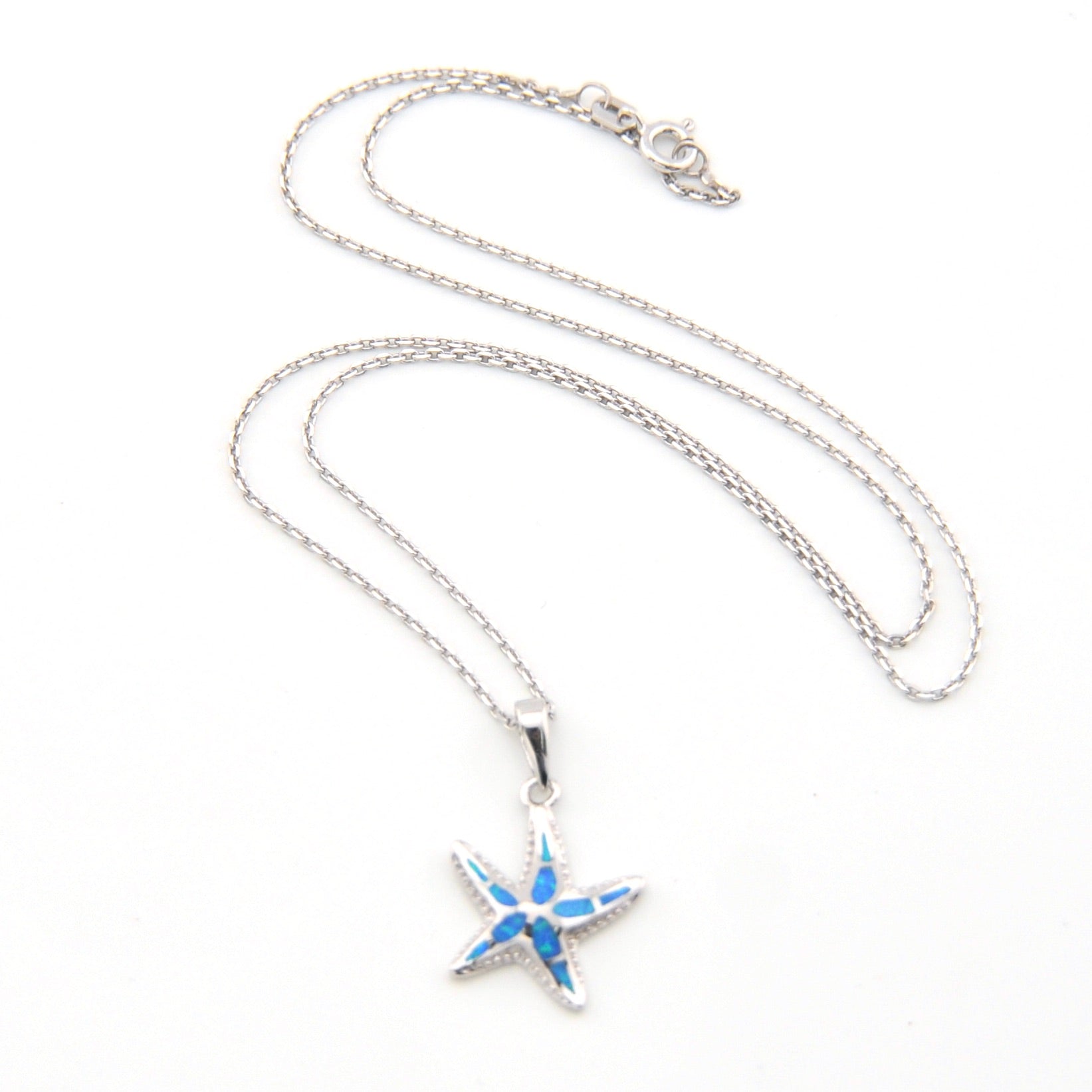Starfish pendant necklace on a white background