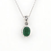 Silver necklace with a green gemstone pendant on a white background