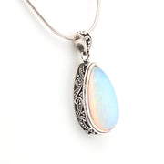 Opal pendant necklace on a white background
