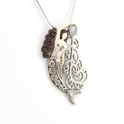 Mermaid pendant necklace on a white background