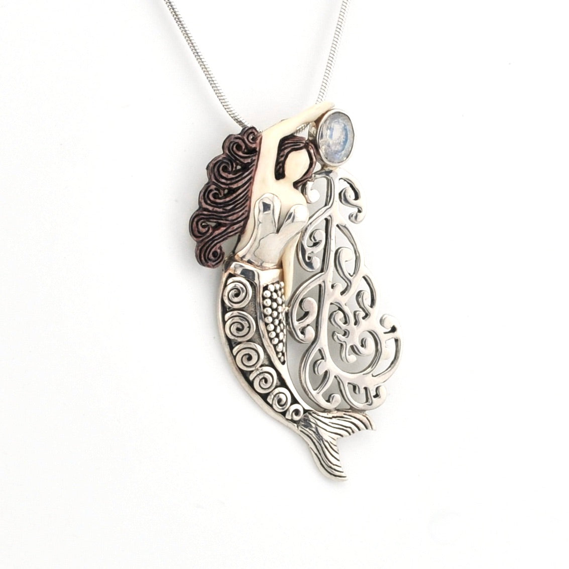 Mermaid pendant necklace on a white background