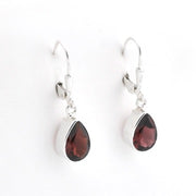 A pair of silver leverback drop earrings featuring teardrop-shaped dark brown gemstones, shown against a plain white background.
