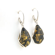 Pair of earrings with black and gold teardrop-shaped stones on a white background