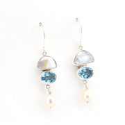 Pair of earrings with gemstones and pearls on a white background