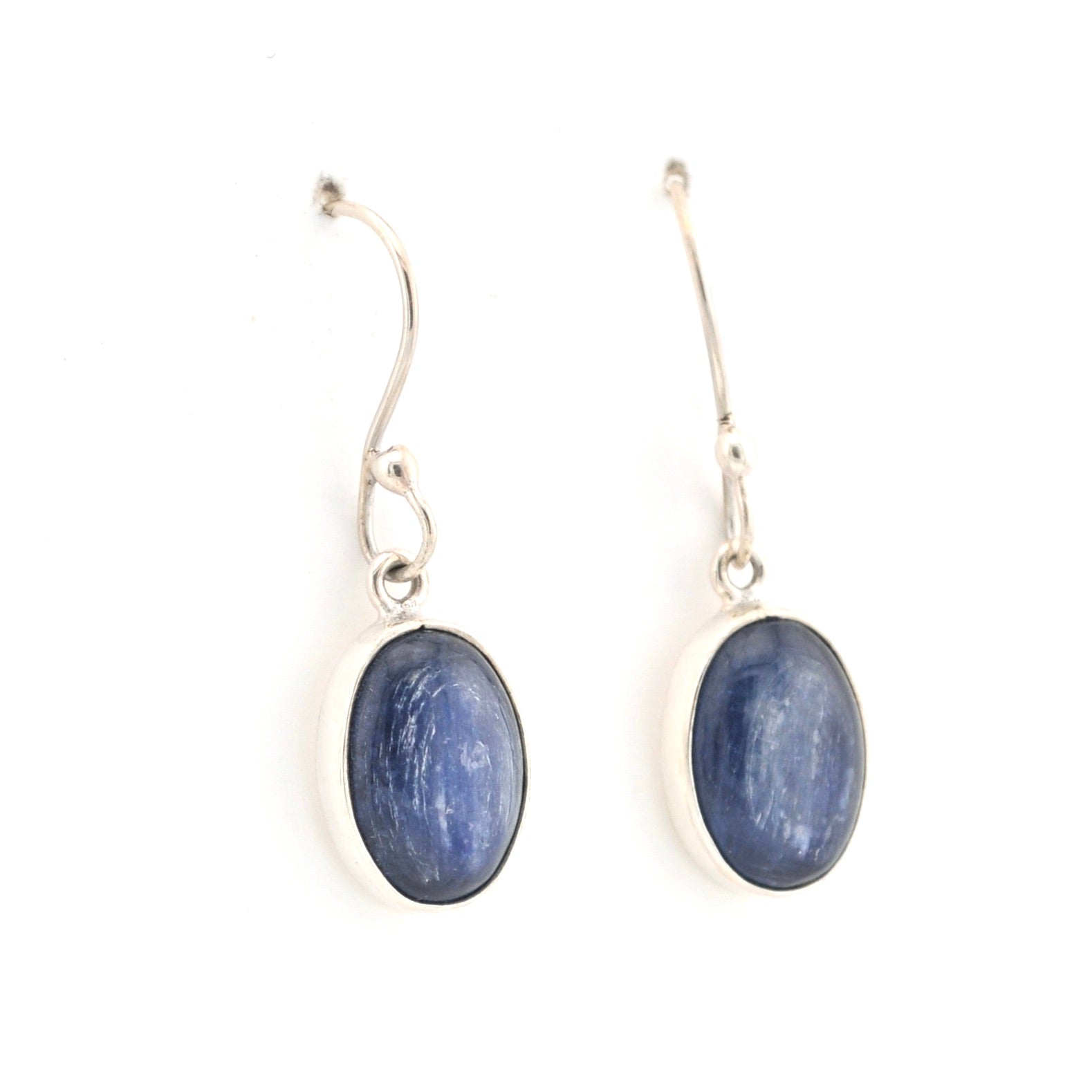 Pair of silver earrings with blue oval stones on a white background