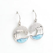 Silver wave-shaped earrings with blue accents on a white background