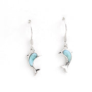 Silver dolphin earrings with light blue accents on a white background