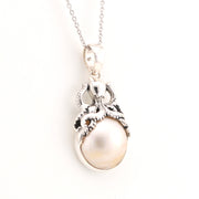 Pearl pendant necklace on a white background
