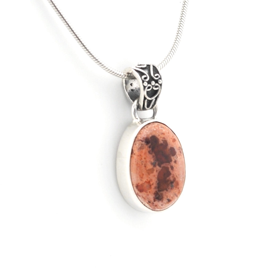 Necklace with a pendant featuring a brown stone on a white background