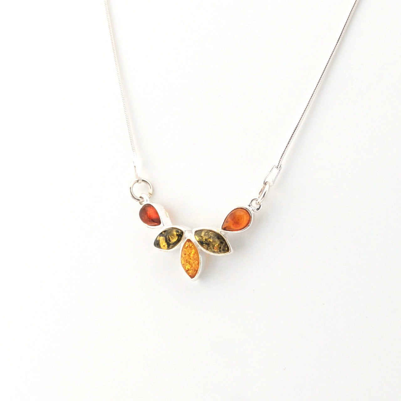 Necklace with amber-colored stones on a white background