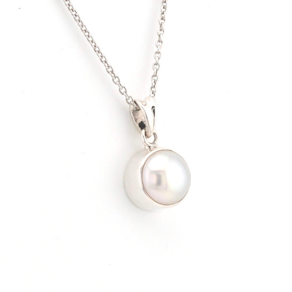 Pearl necklace on a white background