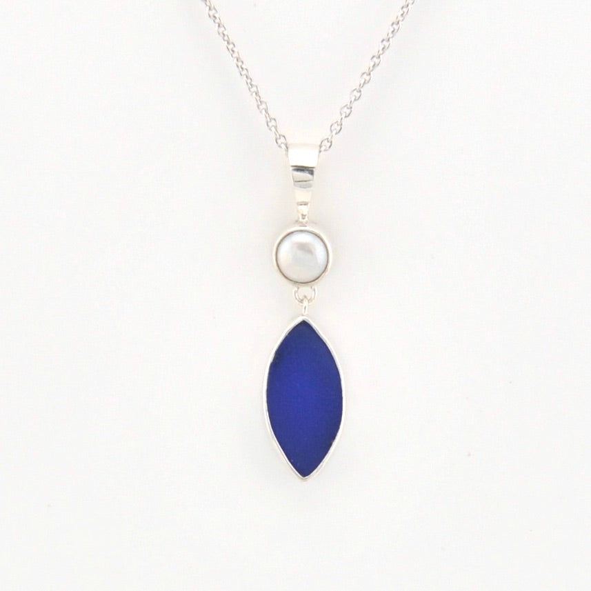Necklace with a blue pendant and silver chain on a white background