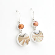 Silver Pearl Nautilus Shell Dangle Earrings on white background