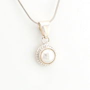 Silver necklace with a pearl pendant on a white background
