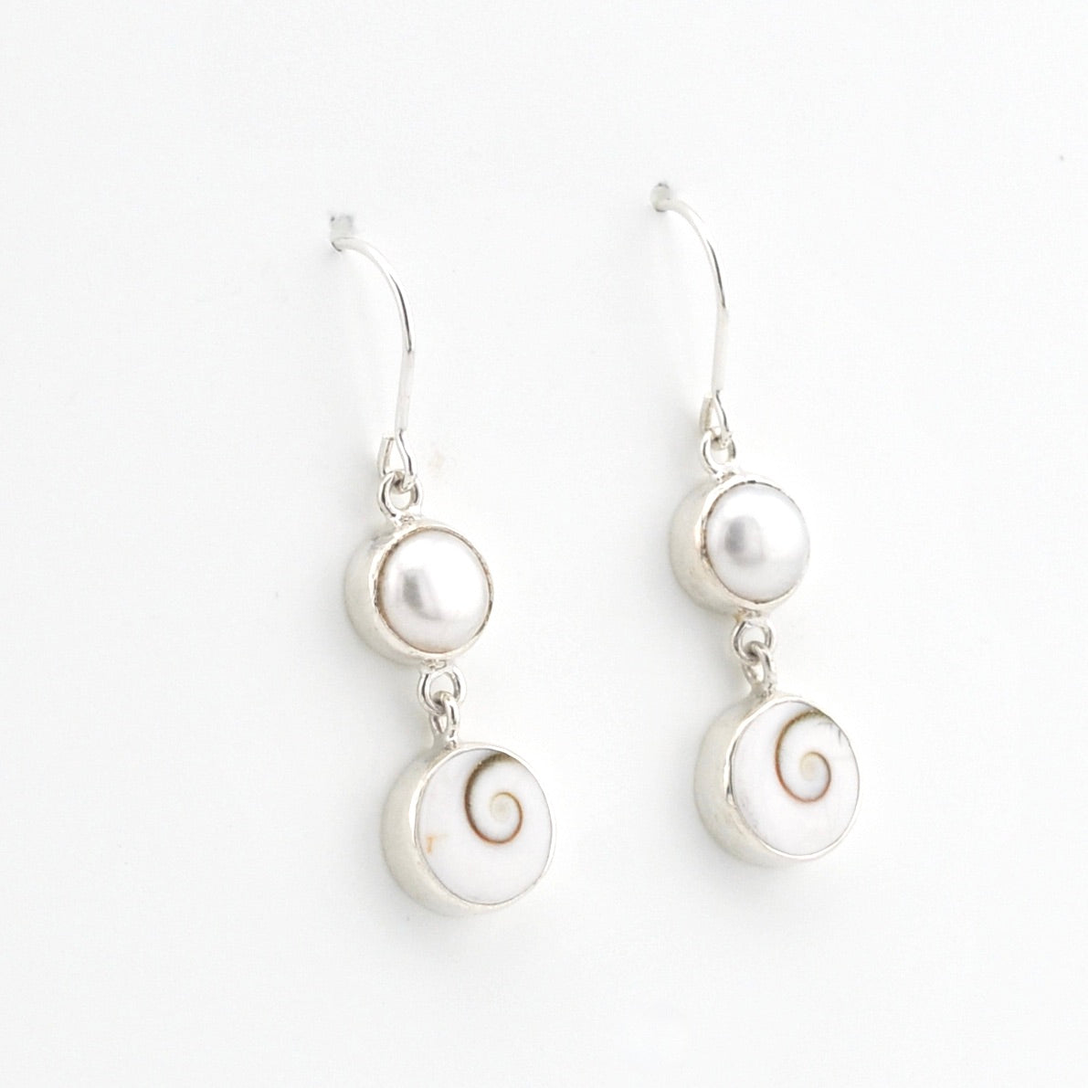 Silver Pearl Shiva Shell Earrings on white background