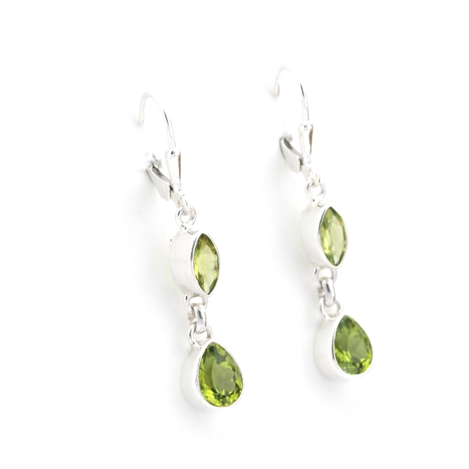 Silver earrings with green teardrop-shaped gemstones on a white background