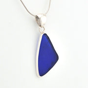 Blue pendant necklace on a white background