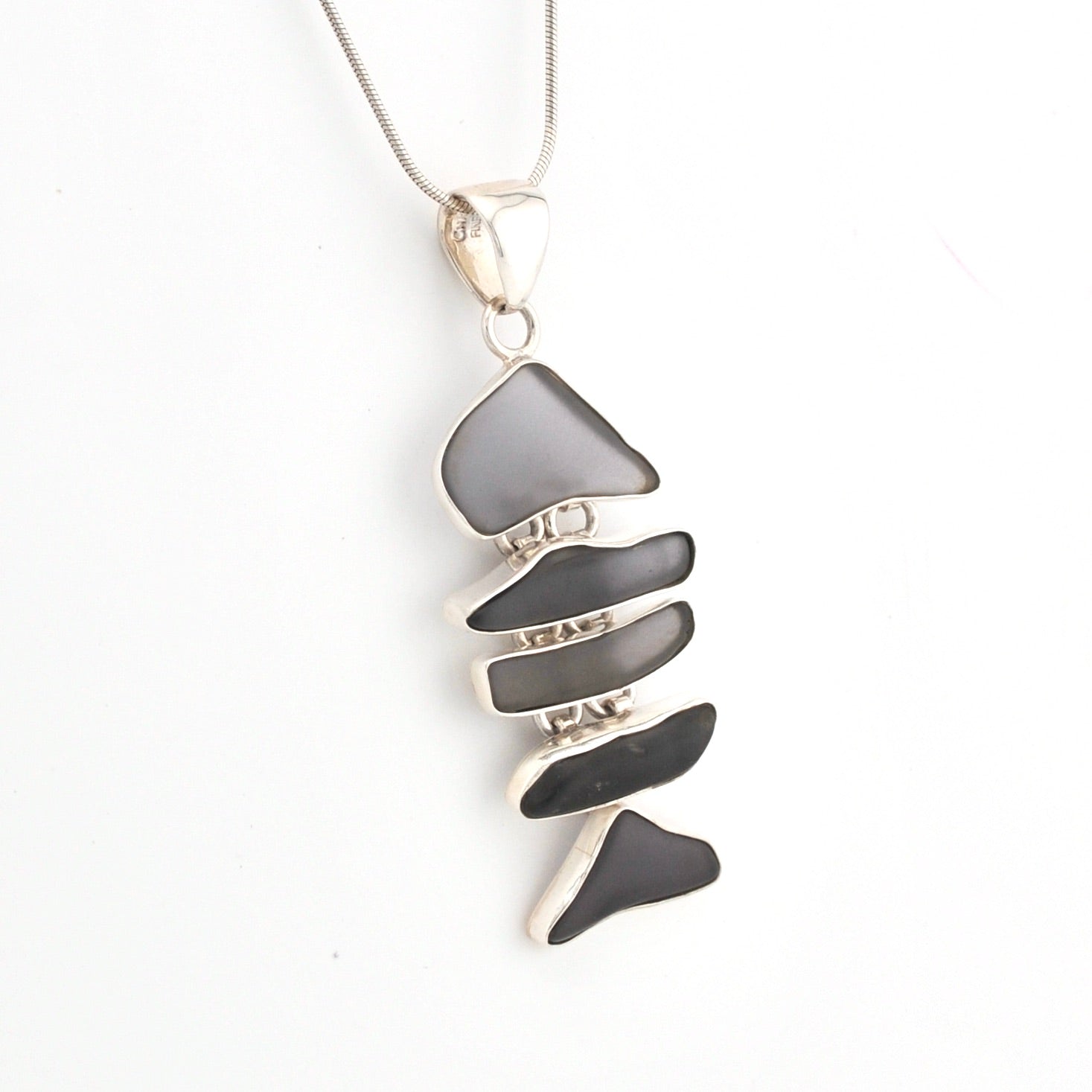 Necklace with a gray pendant on a white background