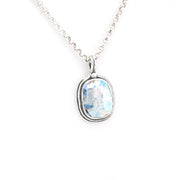 Silver necklace with a pendant featuring a blue Roman glass on a white background