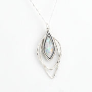 Silver pendant with Roman glass on a white background