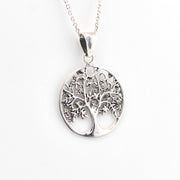 Silver tree of life pendant on a white background