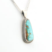 Turquoise pendant necklace on a white background