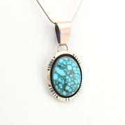 Turquoise pendant necklace on a white background