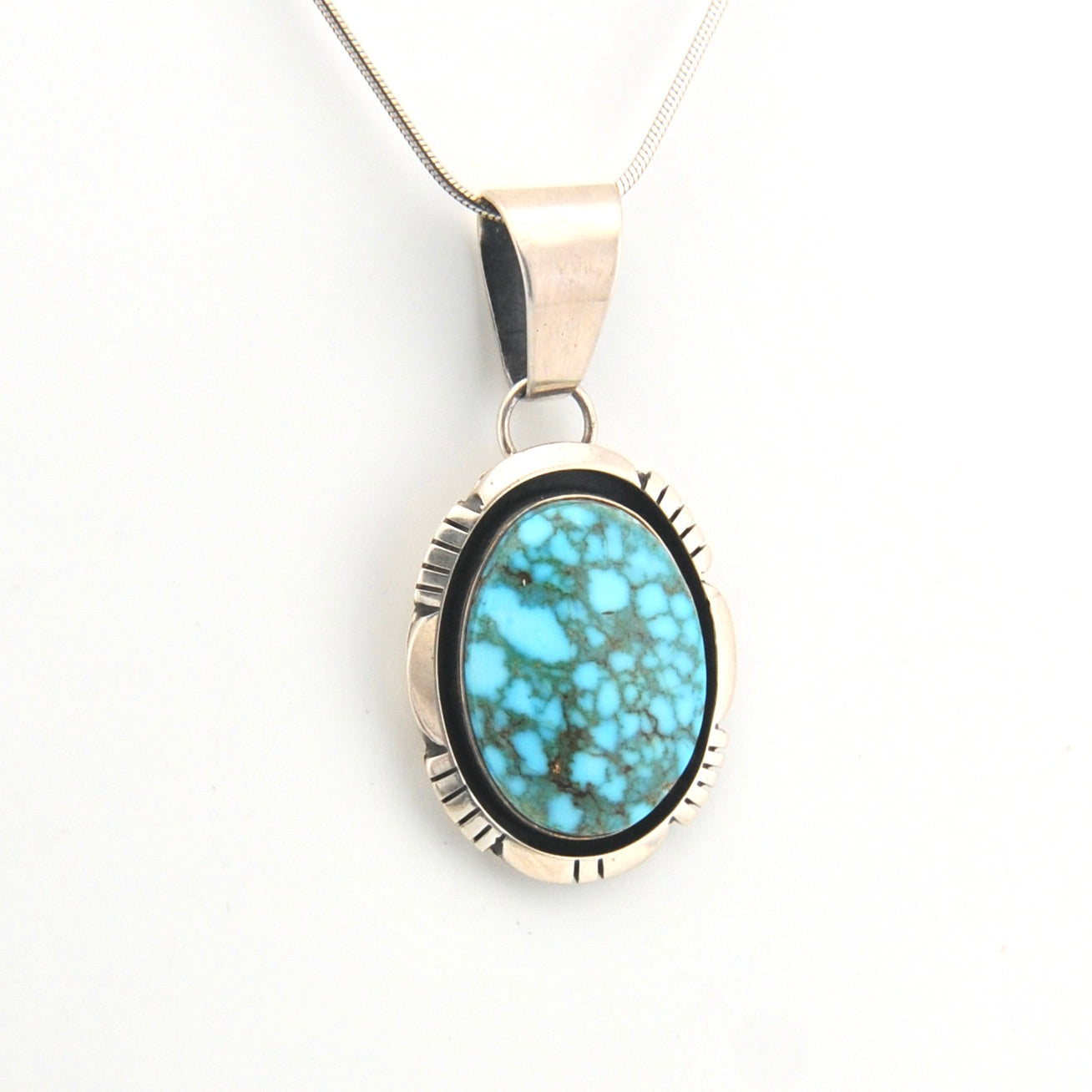 Turquoise pendant necklace on a white background