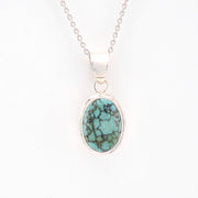 Turquoise pendant necklace on a white background