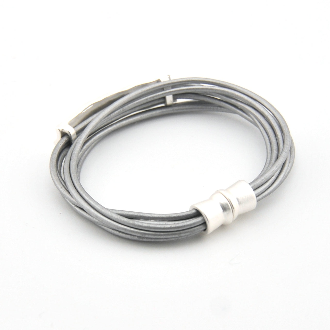 Silver cable with magnetic clasp on a white background