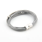 Silver cable with magnetic clasp on a white background