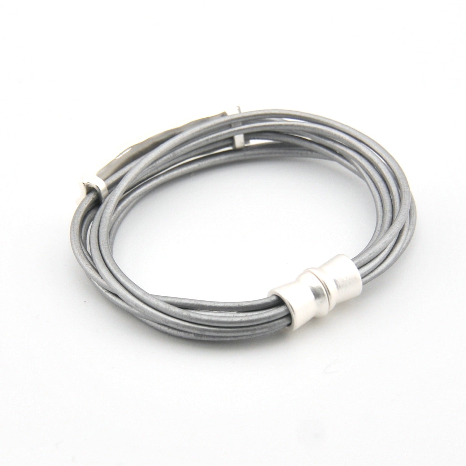 Silver cable with magnetic clasp on a white background