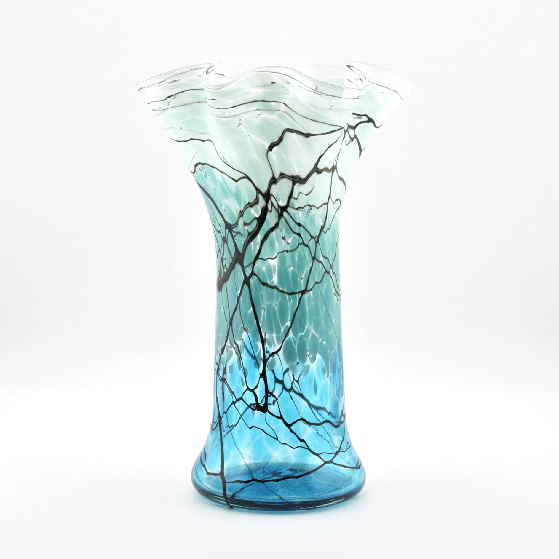 Glass vase with blue and black abstract design on a white background