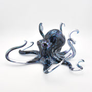 Glass octopus sculpture on a white background