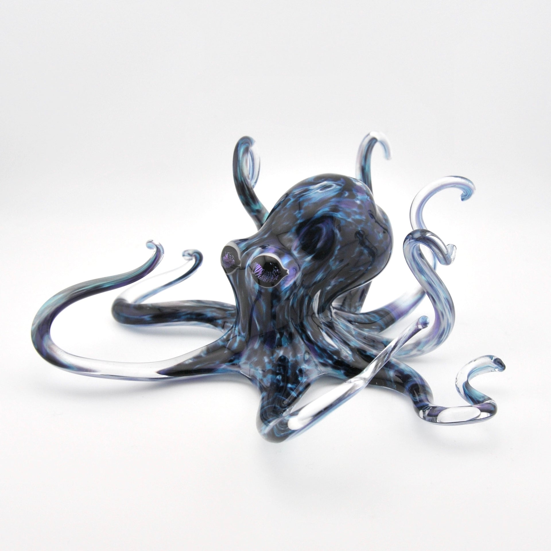 Glass octopus sculpture on a white background
