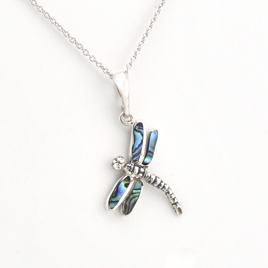 Silver dragonfly pendant with inlaid abalone shell on silver chain.