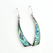 A pair of silver dangle earrings with curved, fan-shaped abalone shell inlays showing iridescent green, blue, and purple patterns, set against a plain white background.