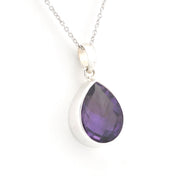 A silver teardrop pendant necklace featuring a faceted purple amethyst gemstone, shown on a clean white background.