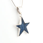 Star-shaped pendant on a white background