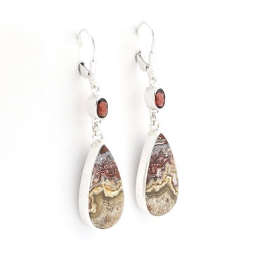 A pair of silver dangle earrings featuring teardrop-shaped agate stone pendants with natural brown, beige, and gray banded patterns, accented by small round brown gemstones and silver hooks, shown on a plain white background.