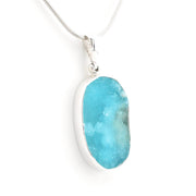 A silver pendant necklace featuring a druzy hemimorphite gemstone on a delicate silver chain, set against a plain white background.