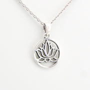 Silver lotus flower pendant on a white background