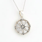 A silver compass rose pendant necklace on a delicate silver chain, displayed against a clean white background.
