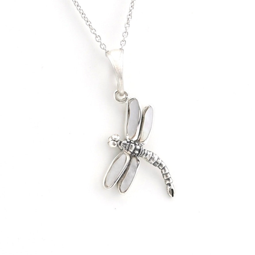 A silver dragonfly pendant necklace with white inlay details, shown on a clean white background.