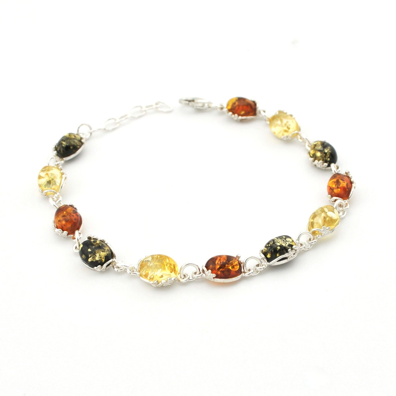 A silver link bracelet featuring oval-cut natural Baltic amber beads in various colors including yellow, orange, and dark brown, displayed on a clean white background.