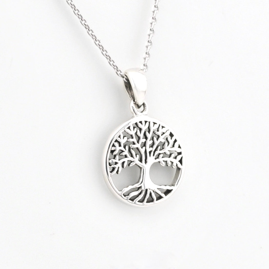 Silver tree of life pendant on a white background