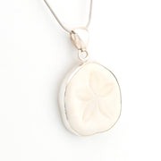 Sterling Silver Sand Dollar Pendant on white background