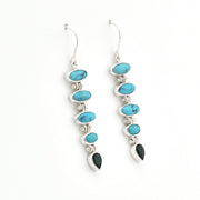 Handmade sterling silver dangle earrings featuring genuine turquoise and green quartz gemstones.