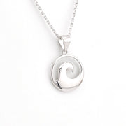 Silver wave pendant necklace on a white background