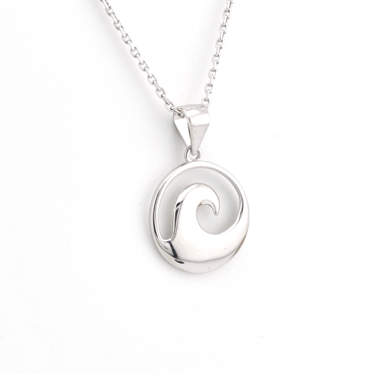 Silver wave pendant necklace on a white background